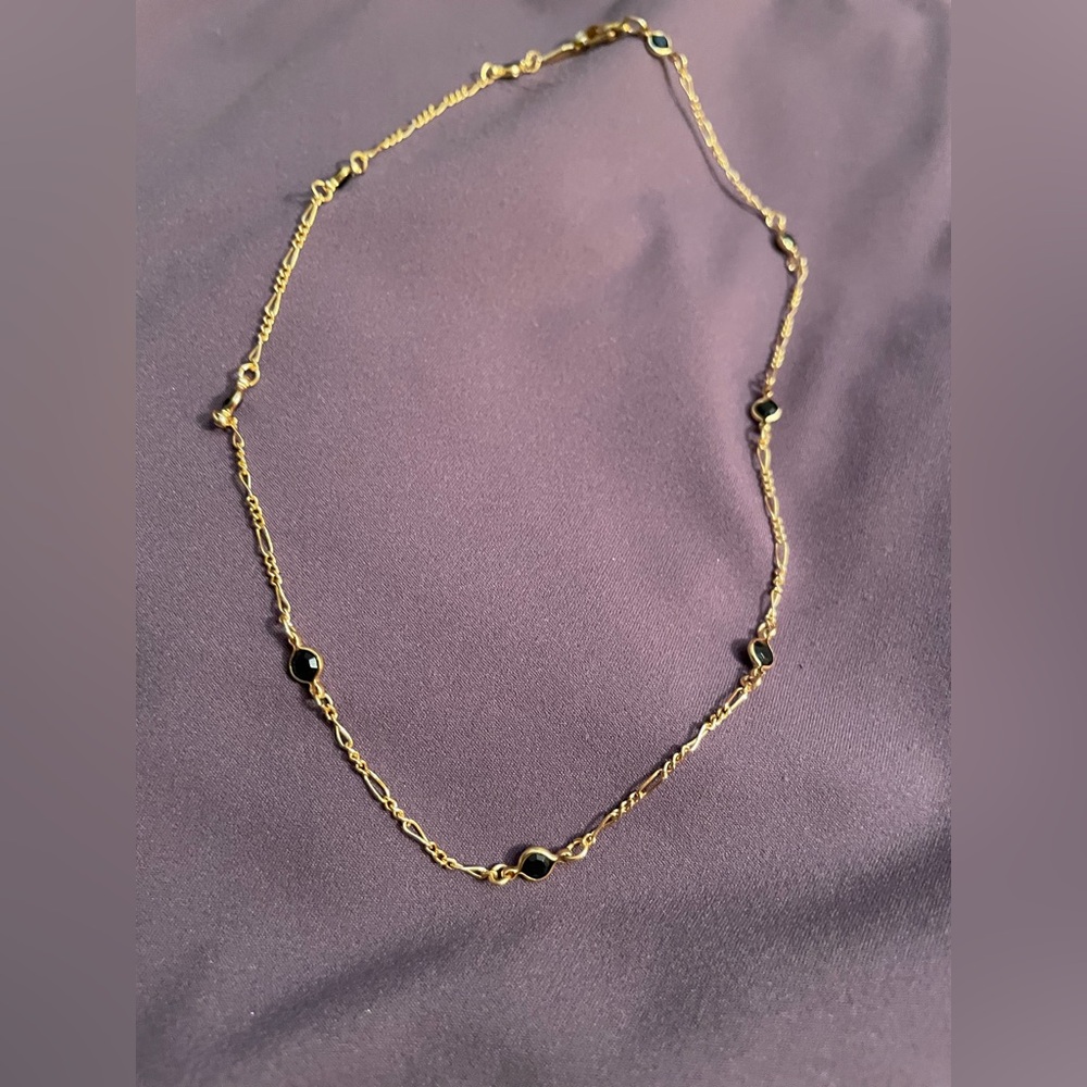 15” gold necklace with black onyx-style gem detailing